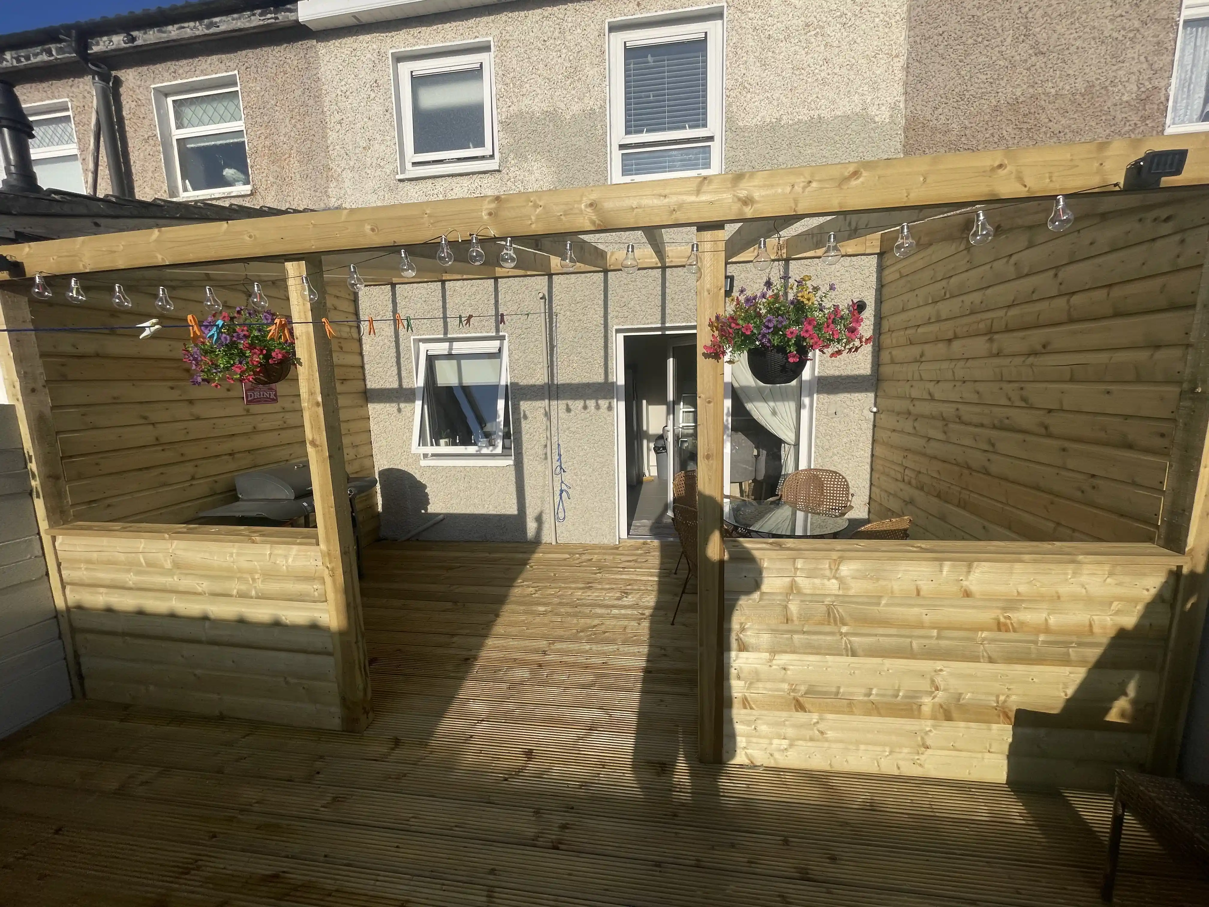 Backyard wooden pergola with seating area Dublin