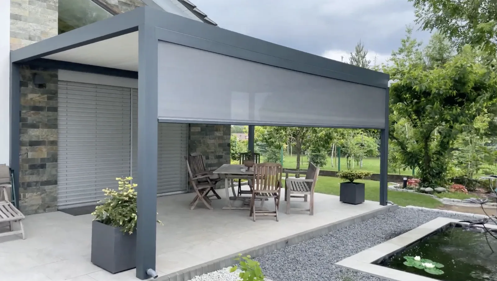 Aerial view of an aluminium bioclimatic pergola with smart retractable roof in a Dublin garden